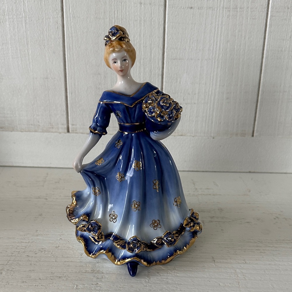 Elegant Blue and Gold lady porcelain figurine stamped KPM